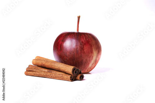 red apple and cinnamon sticks
