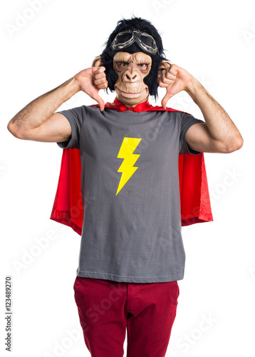 Superhero monkey man doing bad signal © luismolinero