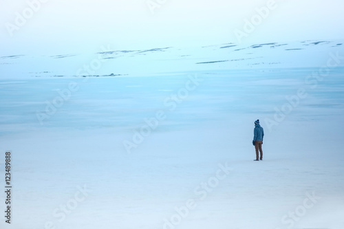 dramatic concept  the man walk in open space snow white