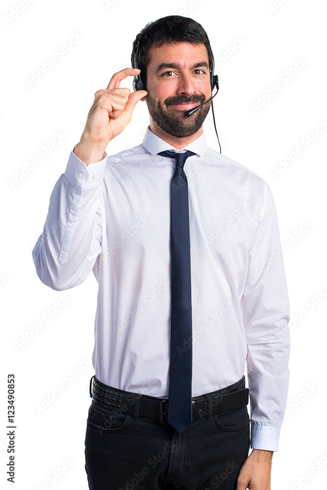 Young man with a headset doing tiny sign Young man with a headset doing tiny sign