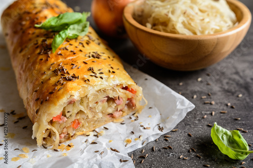 Savory strudel stuffed with sour cabbage, bacon, red pepper and onion