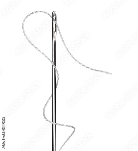 needle with a white thread close up isolated on white background