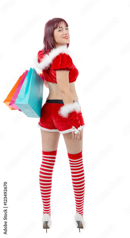 Beautiful Santa Claus woman holding shopping bags Beautiful Santa Claus woman holding shopping bags
