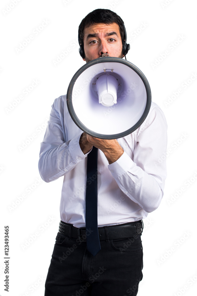 Handsome telemarketer man shouting by megaphone Handsome telemarketer man shouting by megaphone