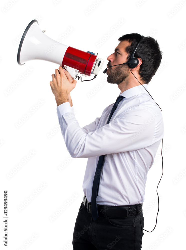 Handsome telemarketer man shouting by megaphone Handsome telemarketer man shouting by megaphone