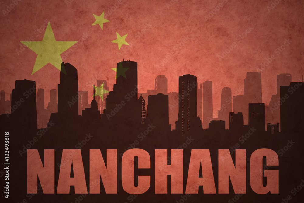 abstract silhouette of the city with text Nanchang at the vintage chinese flag background