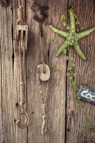 Vintage nautical traveling still life with accessories on old wooden background 