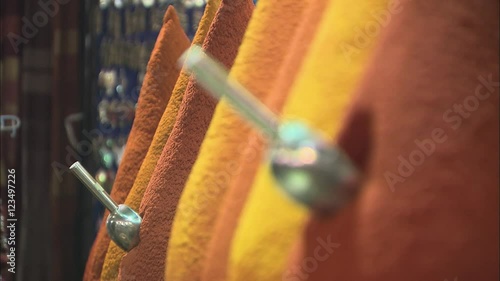 Heaps of colorful spices in a Moroccan market stall