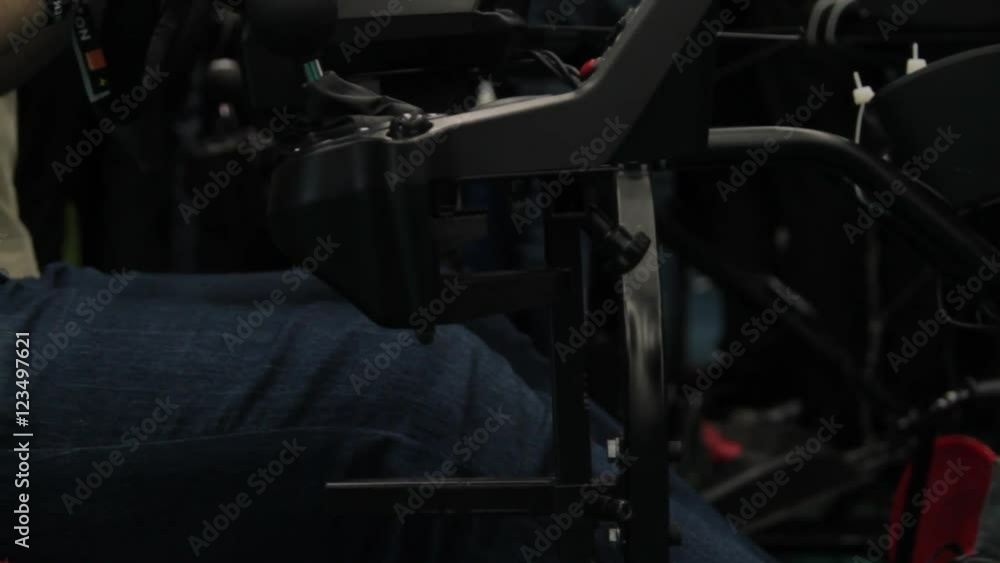 Young Man Playing In A Car Simulator, Game, Tournament, Convention, Comicon Young Man Playing In A Car Simulator, Game, Tournament, Convention, Comicon
