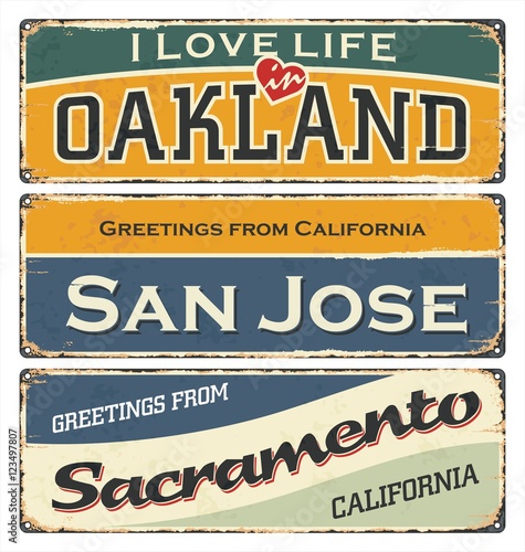 Vintage tin sign collection with USA cities. Oakland. San Jose. Sacramento. Retro souvenirs or postcard templates on rust background.
