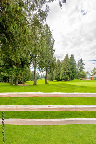 Golf course with wooden fence
