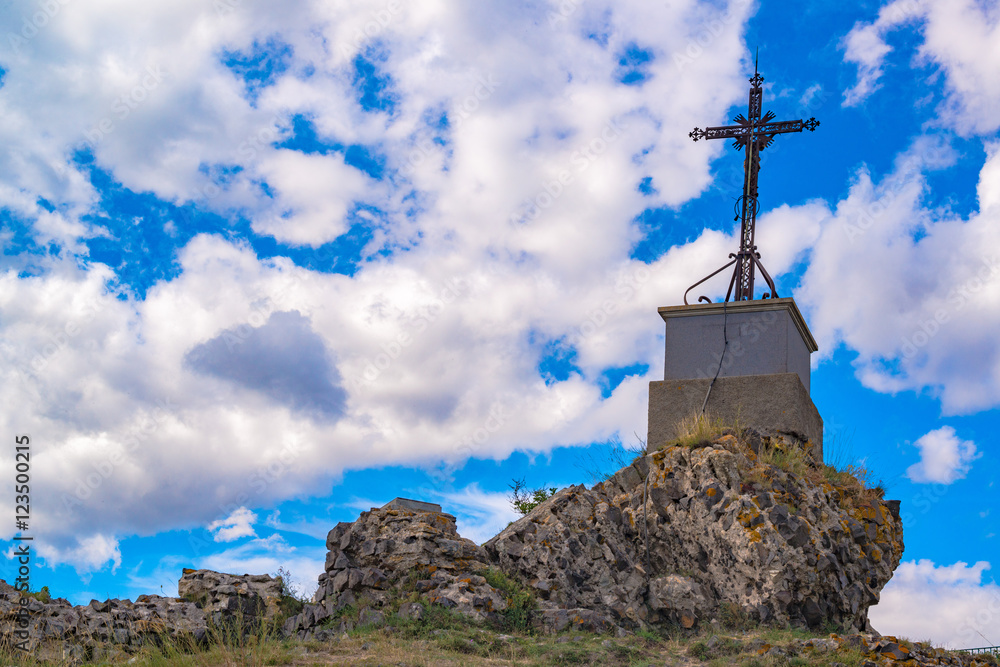 cross in a peak of mountain in Auvergne, France cross in a peak of mountain in Auvergne, France