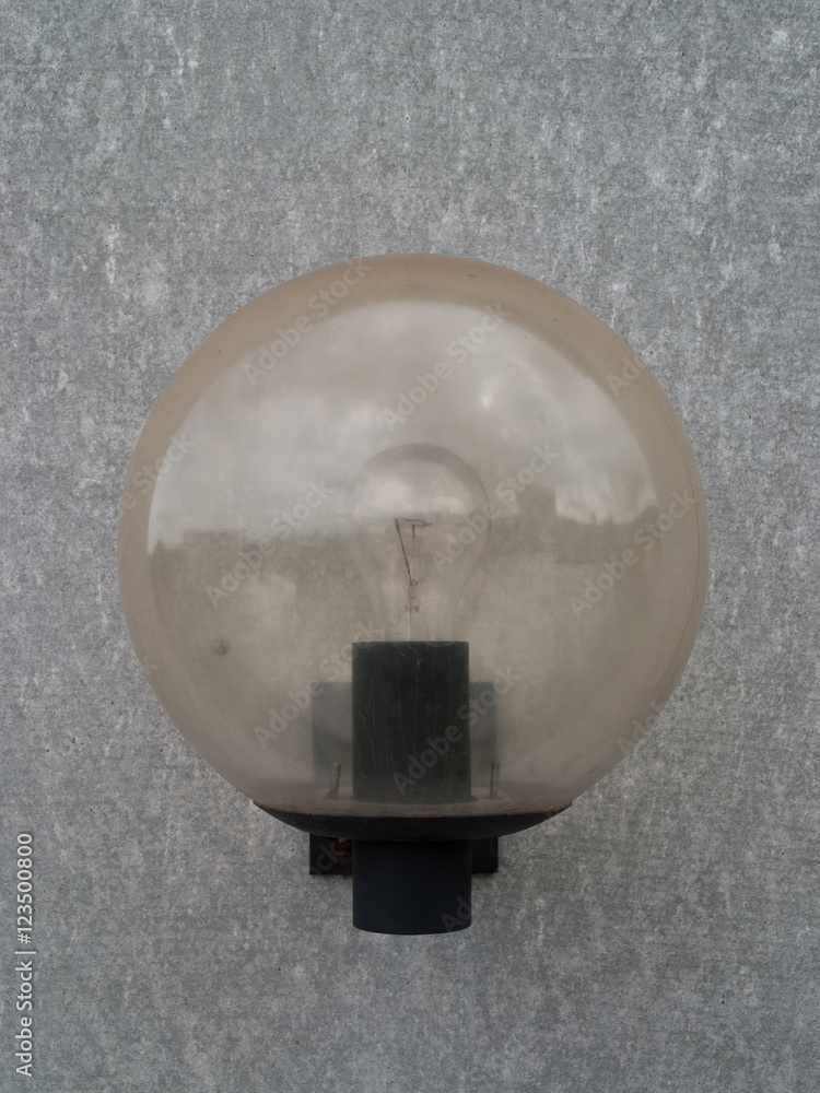 Close Up of a eternit wall (asbestos cement), with a single lamp and structure and details Close Up of a eternit wall (asbestos cement), with a single lamp and structure and details