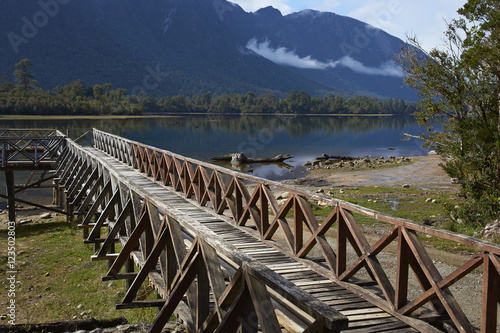 Wooden jetty on the edge of the calm waters of Lake Rosselot located along the Carretera Austral  in the Aysen Region of southern Chile. photo