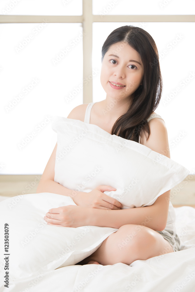 beautiful asian woman smile face to camera holding pillow beautiful asian woman smile face to camera holding pillow