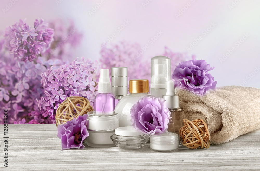 Set of body care products on flowers background Set of body care products on flowers background