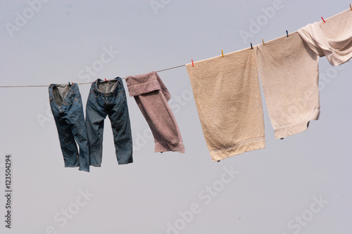 Denim jeans drying on a clothes line