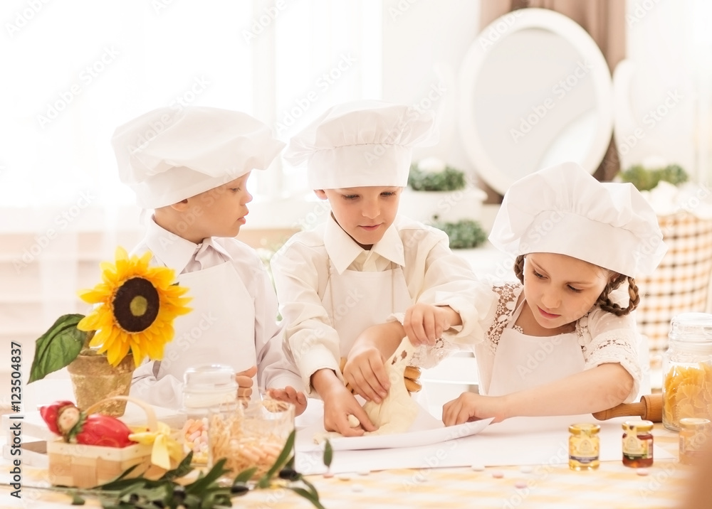 happy little children in the form of a chef to prepare delicious happy little children in the form of a chef to prepare delicious