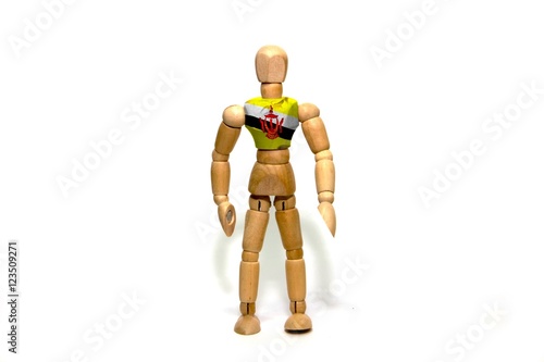 Wooden puppet with Brunei flag on body