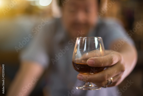 drunk man with a glass of brandy.