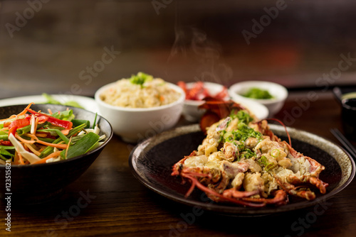 Hot lobster dish served with mix salad