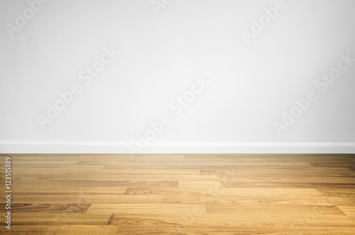 Laminated wood floor with white wall