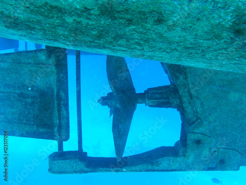 Propeller of metal boat in the red sea. Underwater picture photo