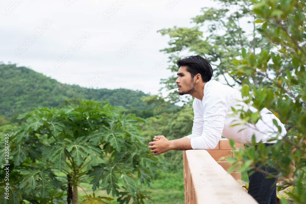 Young hipster man taking rest, smoking cigarette with nature and Young hipster man taking rest, smoking cigarette with nature and