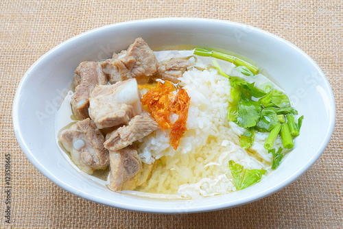 boiled rice with pork rib hot soup on bowl
