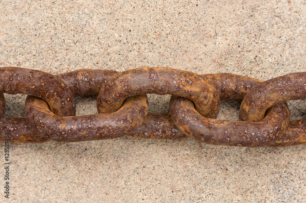 Rusty chains, lay in the middle of the stone flooring. Rusty chains, lay in the middle of the stone flooring.