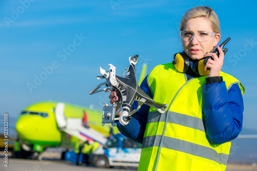 airport worker with crashed drone