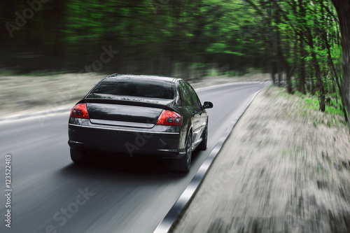 Car drive on asphalt countryside forest road at daytime © Ivan Kurmyshov