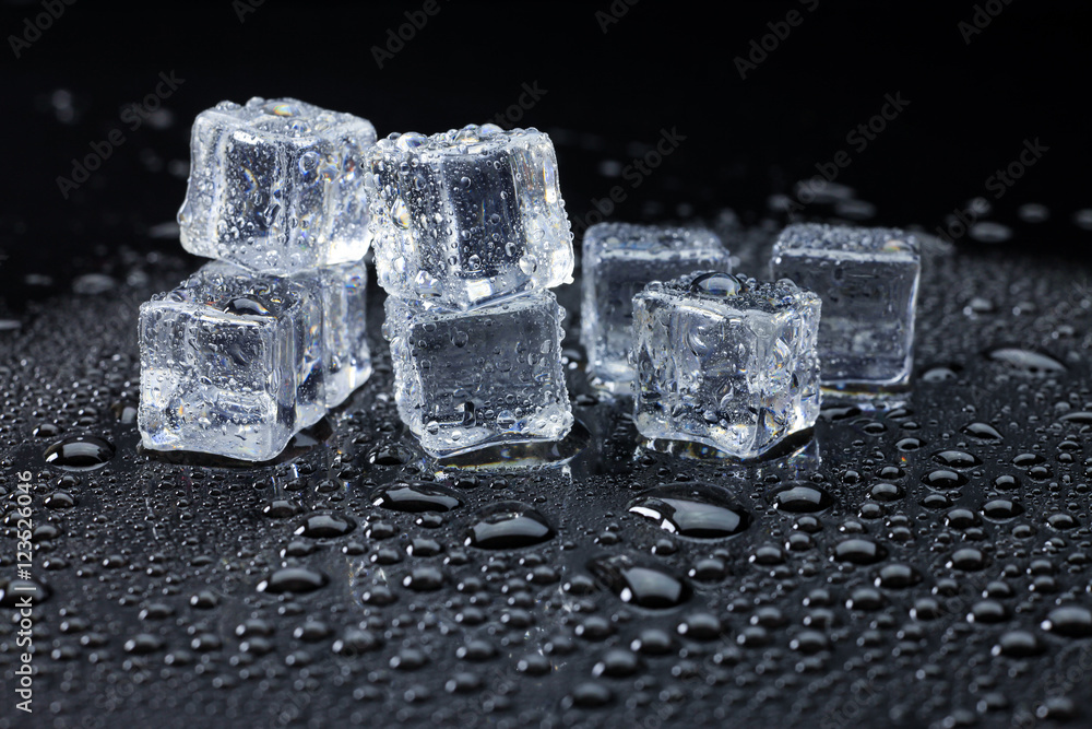 Wet ice cubes and water drop on black background. Wet ice cubes and water drop on black background.