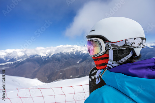 Portrait of woman snowboarder