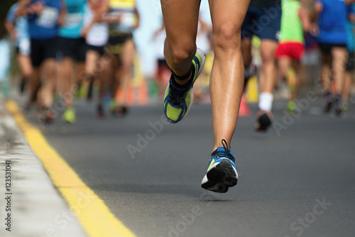 Marathon running race  people feet on city road