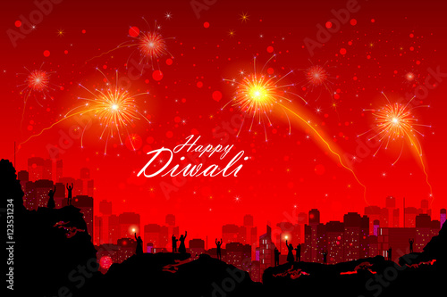 People watching fireworkin Happy Diwali night sky for India festival