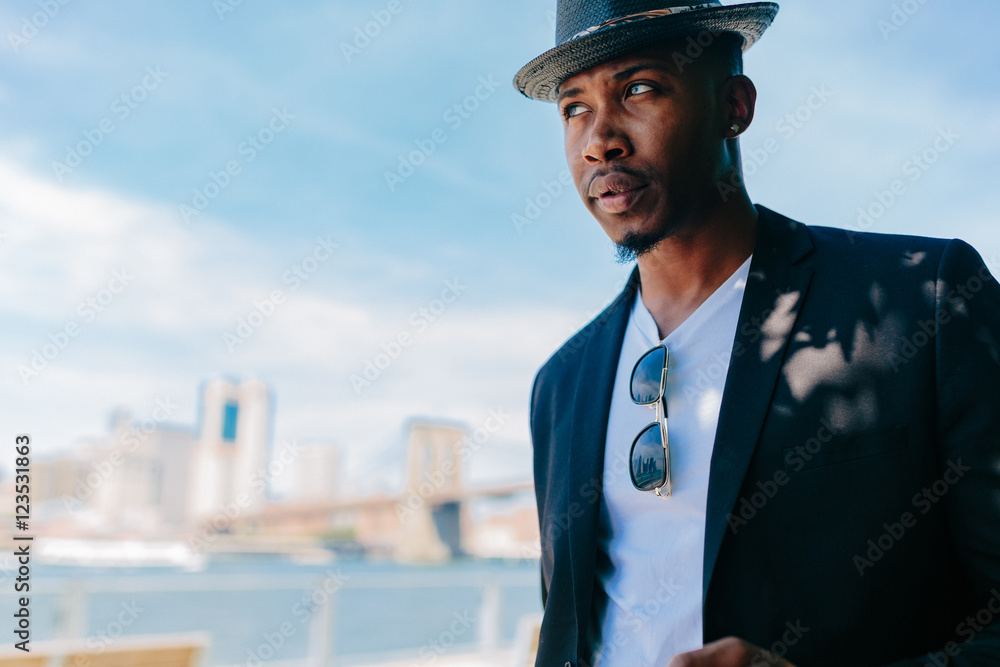 Handsome Young Freelance Portrait in Brooklyn , New York City . Manhattan Skyline on the Back Ground Handsome Young Freelance Portrait in Brooklyn , New York City . Manhattan Skyline on the Back Ground