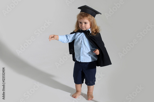 education boy with wooden blocks isolated