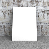 Blank white poster in empty interior. Concrete wall, stone floor