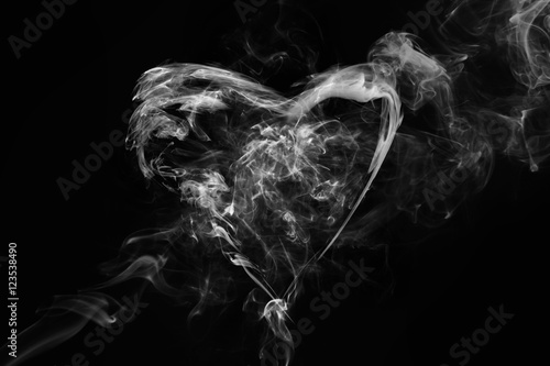 Smoke heart shape in the dark.