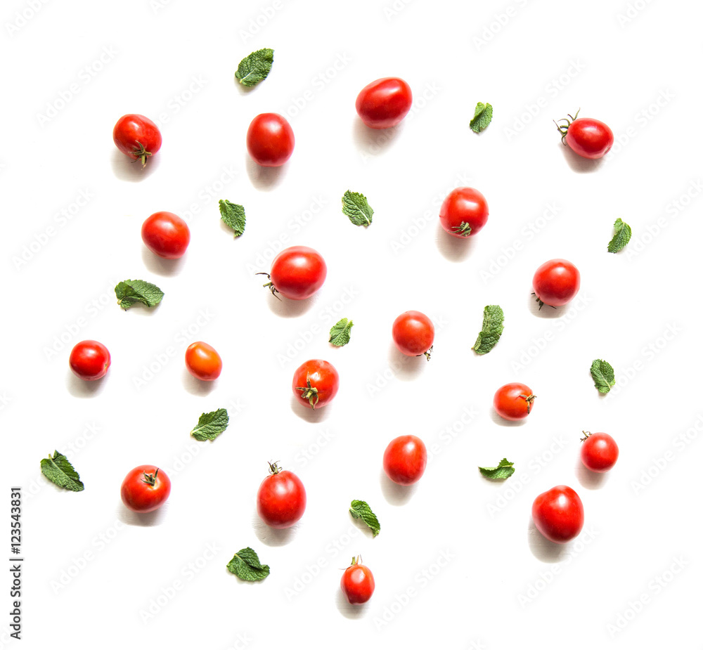 Tomatoes and basil leaves isolated on white top view. Tomatoes and basil leaves isolated on white top view.