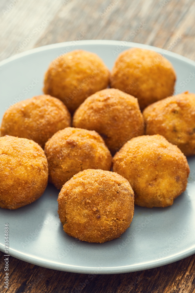 Arancini sicilian street food - rice balls stuffed with meat cooked Arancini sicilian street food - rice balls stuffed with meat cooked