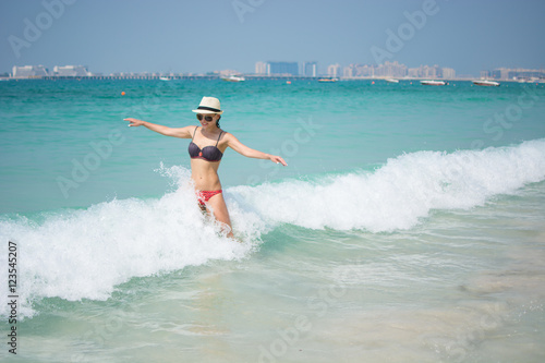 young girl on the beach in Dubai, Dubai Marina Bay © a_reanda