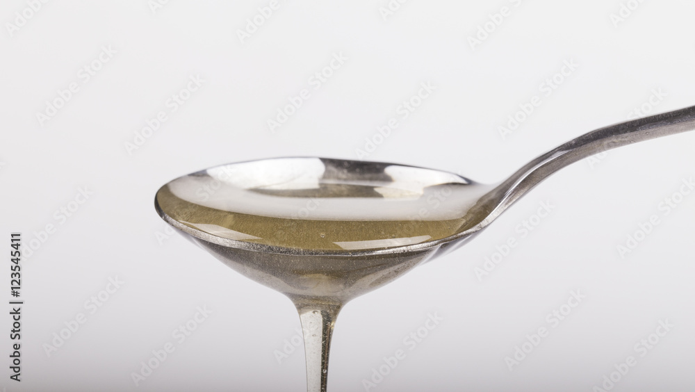 Honey and spoon closeup Honey and spoon closeup