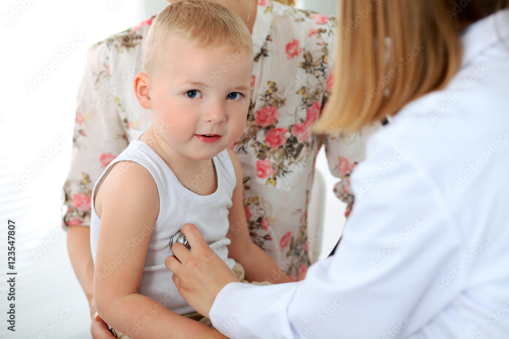 Doctor examining a child patient by stethoscope Doctor examining a child patient by stethoscope