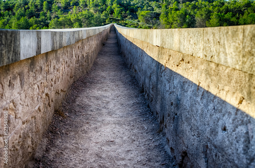 Inside view on roman aqueduct channel near Tarragona, Spain