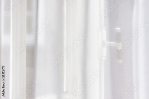 Window behind curtain