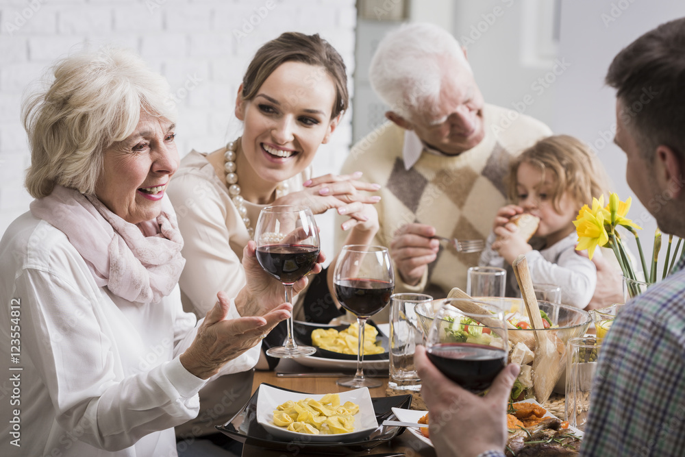 Elegant dinner of a multigenerational family Elegant dinner of a multigenerational family