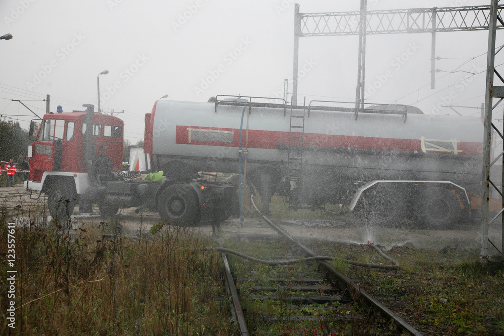 Fototapeta premium firemen in action, Firefighters exercises train accident, chemical contamination