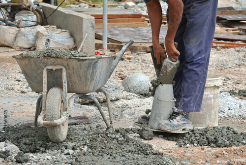 Tableau sur toile Construction workers doing slump test using equipment at the construction site